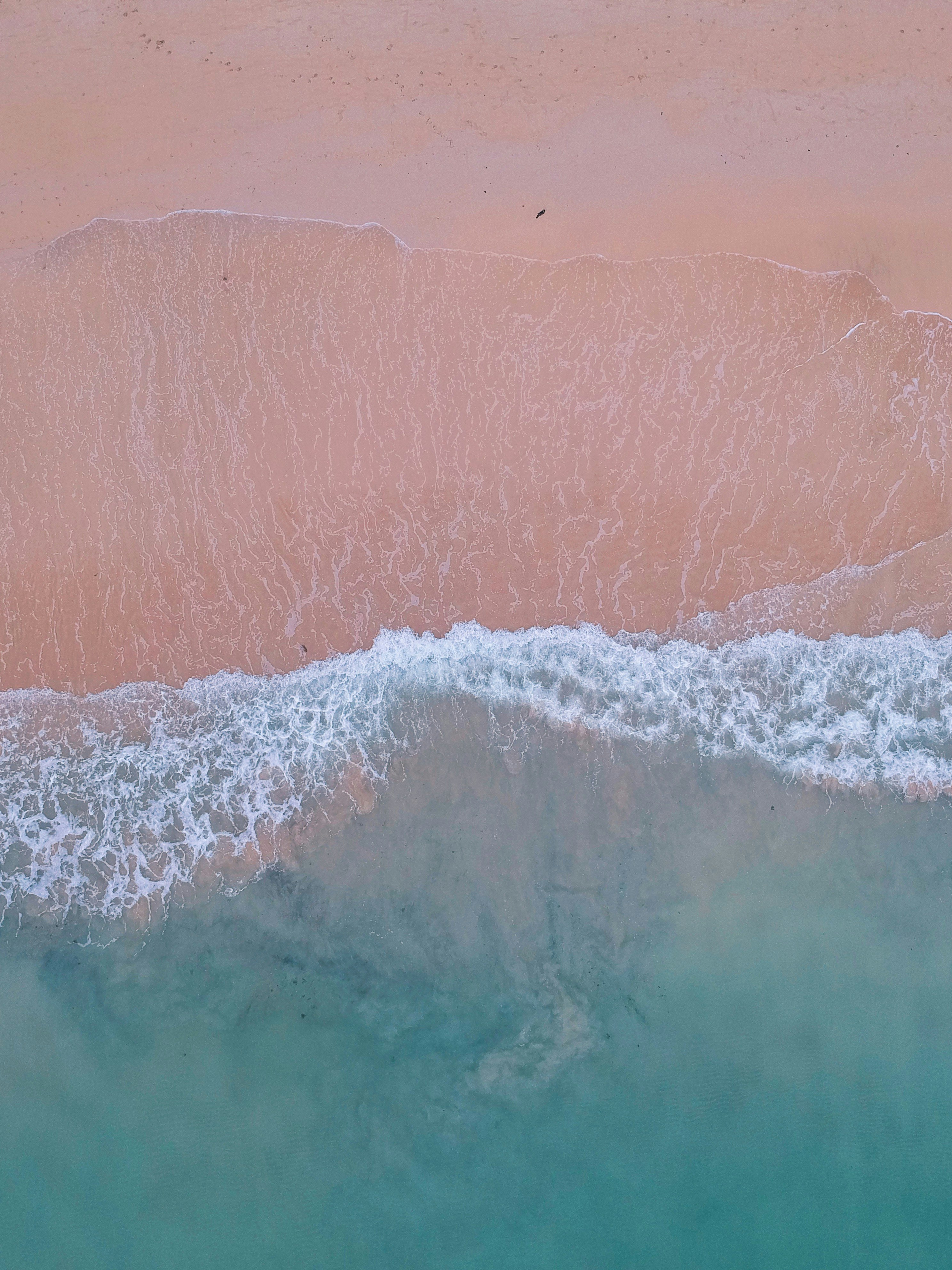 blue ocean waves on shore